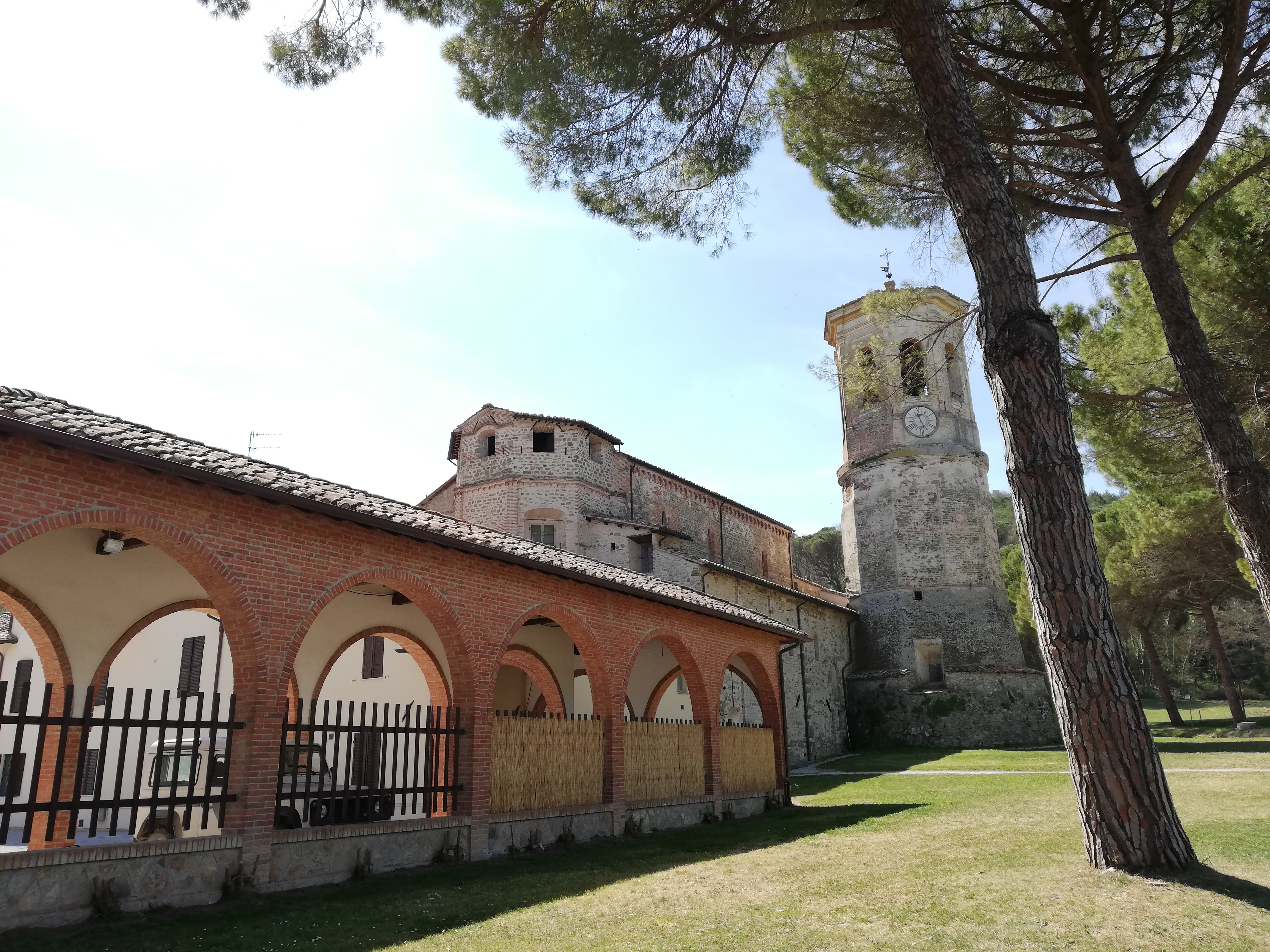 View of the garden, abbey with maritime pines